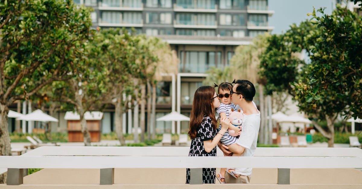 schengen mother and child hotel reservations - Young happy family on vacation schengen mother and child hotel reservations - Young happy family on vacation