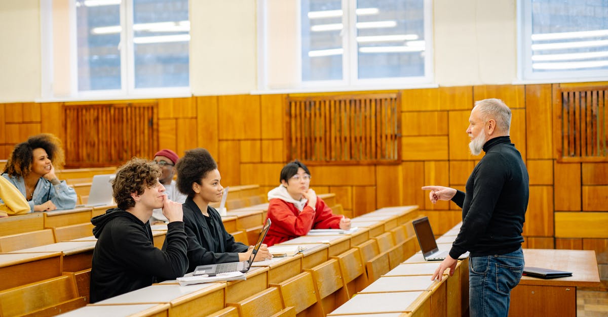 Schengen Visa and International Students - People Sitting on Brown Wooden Chairs Schengen Visa and International Students - People Sitting on Brown Wooden Chairs