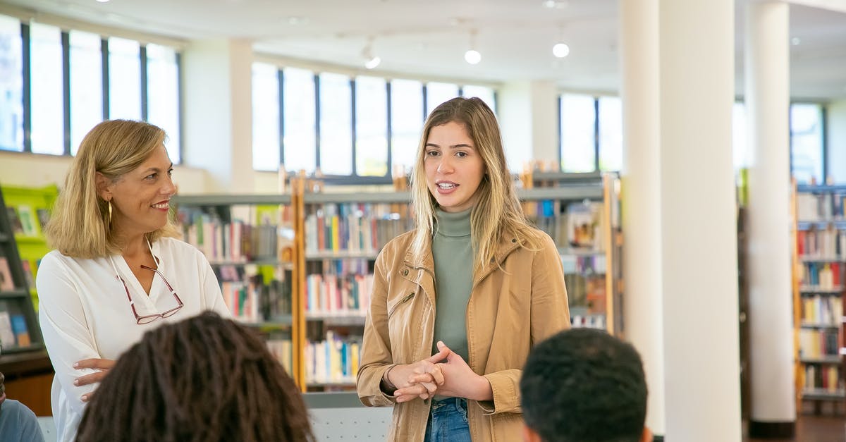 Schengen Visa Application: Academic Conference - Young student making presentation to classmates and teacher Schengen Visa Application: Academic Conference - Young student making presentation to classmates and teacher