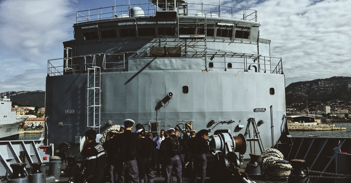 Schengen Visa at the border for spouse of ship's crew member - Ship Crew Standing On Ship