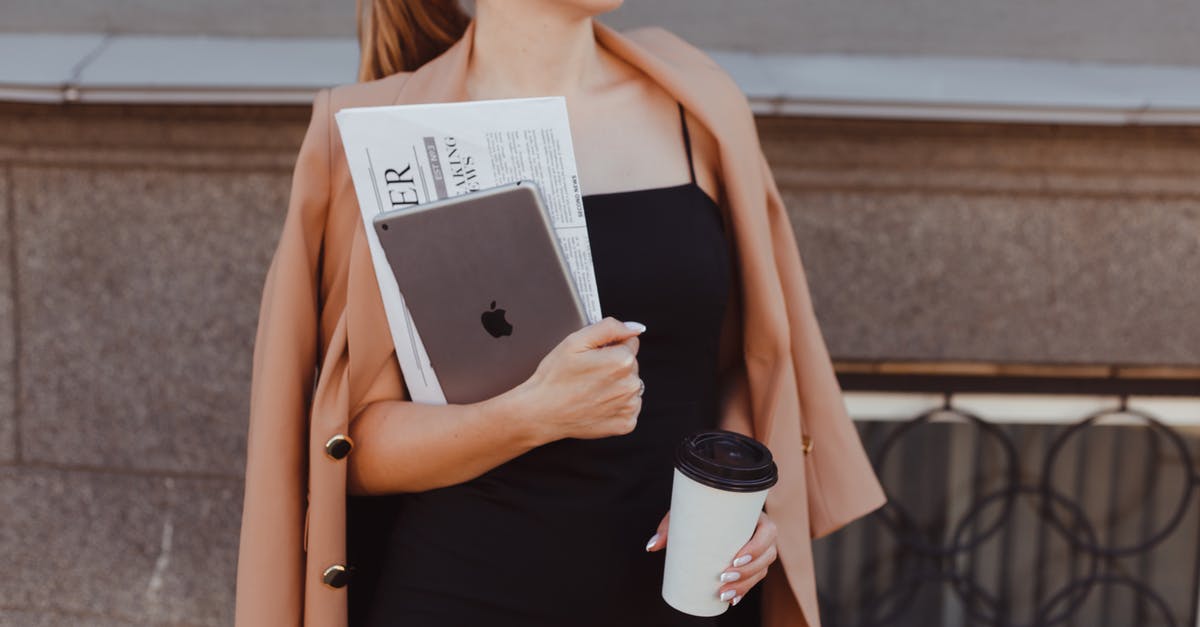 Schengen Visa Expires before the end of work permit (TWV) - Business Woman Standing Before Building and Holding Tablet and Coffee Cup