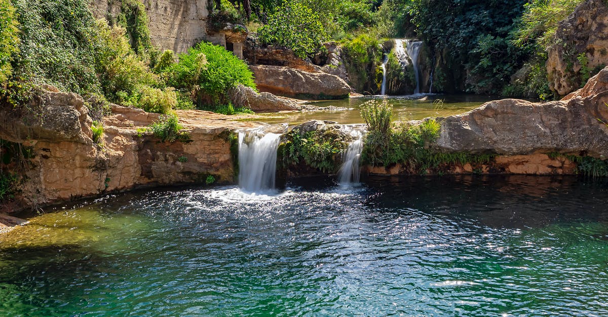Schengen visa for Spain - Water Falls on Brown Rocky Mountain Schengen visa for Spain - Water Falls on Brown Rocky Mountain