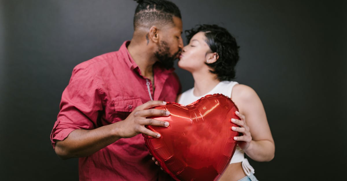 Schengen visa refused but my husband's was granted - Couple Kissing While Holding a Red Heart Shaped Balloon Schengen visa refused but my husband's was granted - Couple Kissing While Holding a Red Heart Shaped Balloon