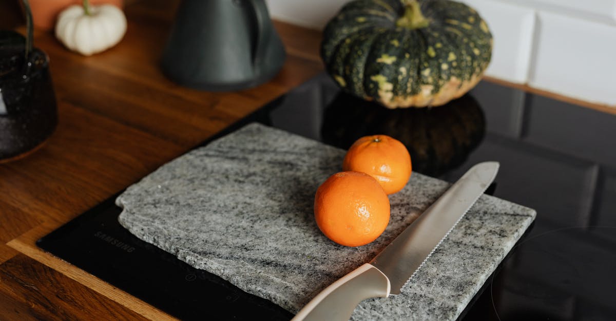 Screwdrivers, scalpel and knife in checked baggage - Orange Fruit on Black Table Mat Screwdrivers, scalpel and knife in checked baggage - Orange Fruit on Black Table Mat