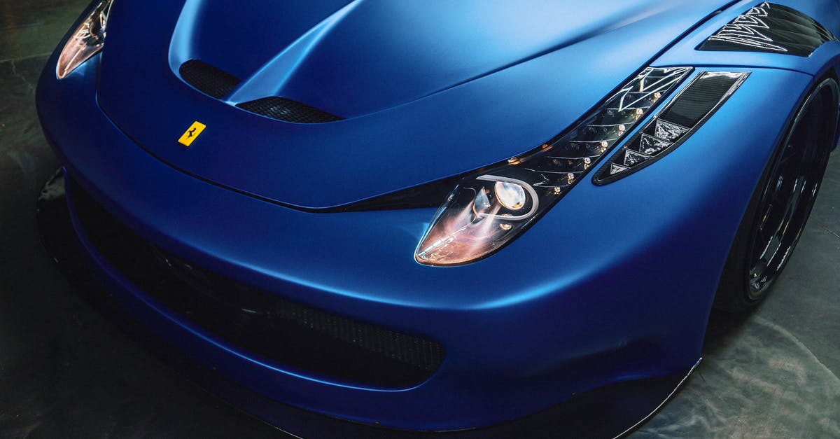 Search engine of Italian buses - From above of stylish front bumper and glowing curvy headlights of modern luxury sports car Search engine of Italian buses - From above of stylish front bumper and glowing curvy headlights of modern luxury sports car