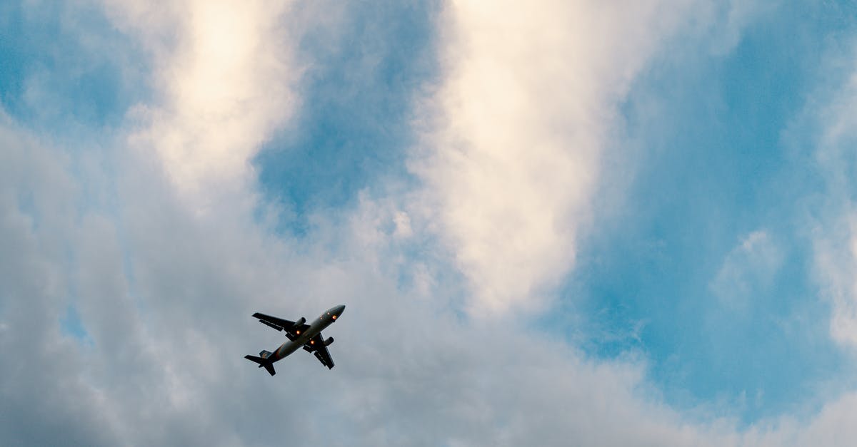 Searching for flights to destinations matching weather / flight time conditions - Aircraft flying in cloudy blue sky Searching for flights to destinations matching weather / flight time conditions - Aircraft flying in cloudy blue sky