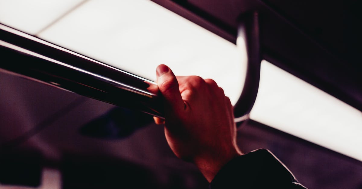Second hand train tickets - France / Thalys - Human's Hand Holding on Silver Handle Bar Photography Second hand train tickets - France / Thalys - Human's Hand Holding on Silver Handle Bar Photography