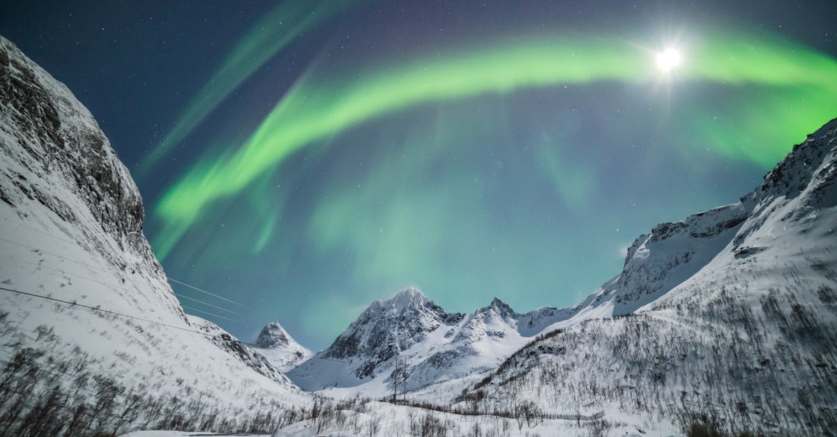 Seeing Northern Lights in Scotland - Aurora Borealis and Sun Visible in Sky of Northern Norway Seeing Northern Lights in Scotland - Aurora Borealis and Sun Visible in Sky of Northern Norway