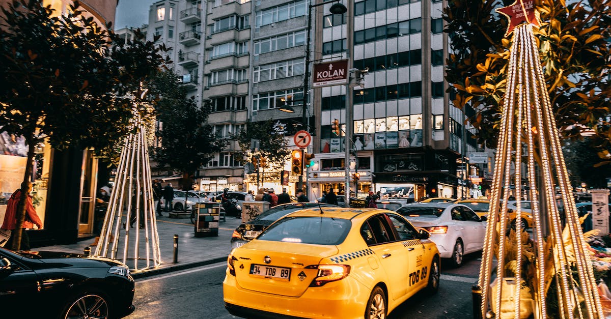 Sensible public transport from Melbourne Airport into city center during rush hour? - Taxi car and vehicles driving on city road Sensible public transport from Melbourne Airport into city center during rush hour? - Taxi car and vehicles driving on city road
