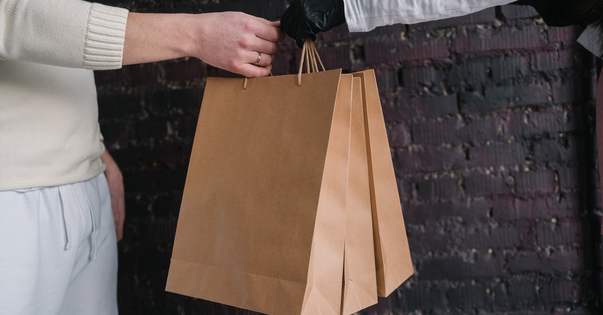 Shipping Labels not received for round trip courier service for UK Visa using VFS Global - Person Holding Yellow Paper Bag Shipping Labels not received for round trip courier service for UK Visa using VFS Global - Person Holding Yellow Paper Bag