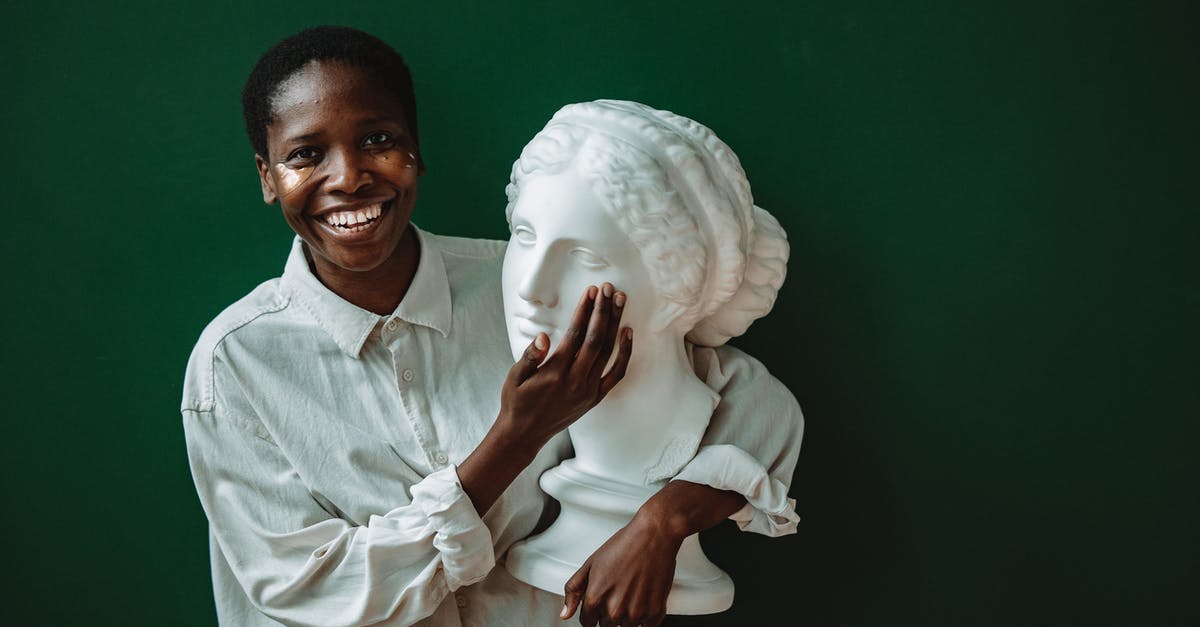 Short connections in Lomé - Man in White Dress Shirt Holding White Textile Short connections in Lomé - Man in White Dress Shirt Holding White Textile