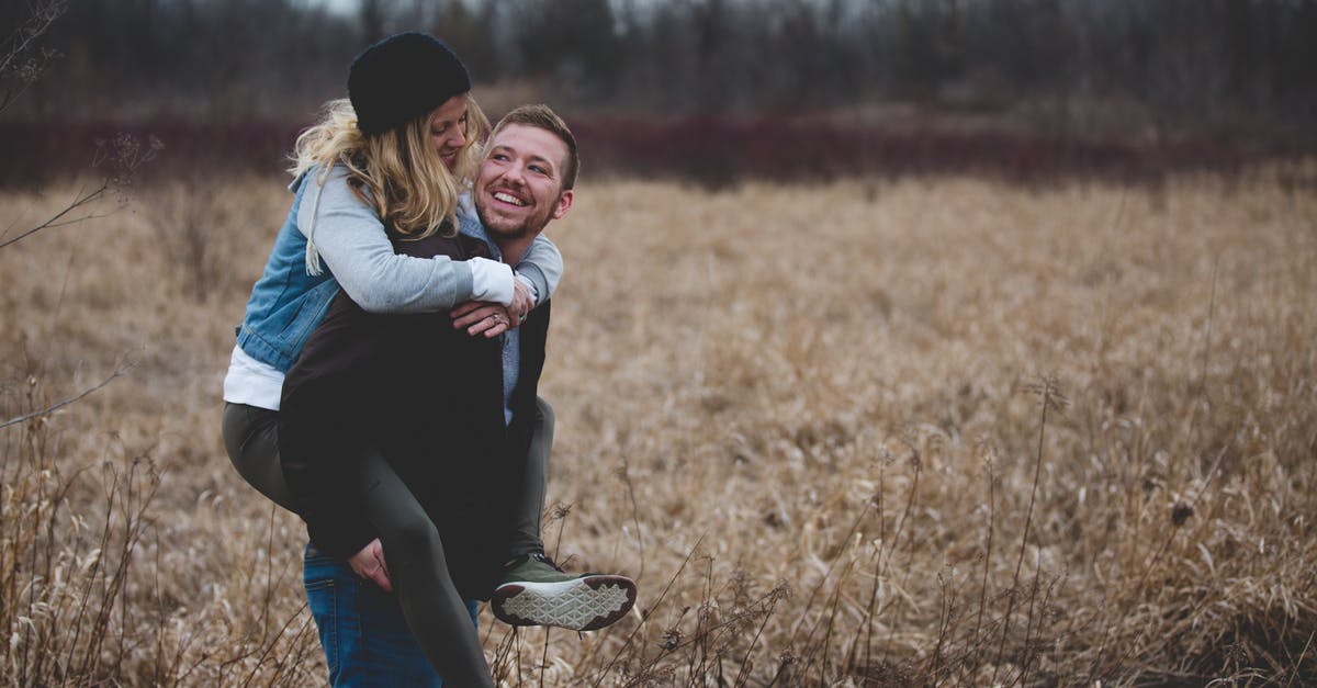 Short Stay Schengen Visa for non Eu spouse - Photo of a Man Carrying His Partner Short Stay Schengen Visa for non Eu spouse - Photo of a Man Carrying His Partner