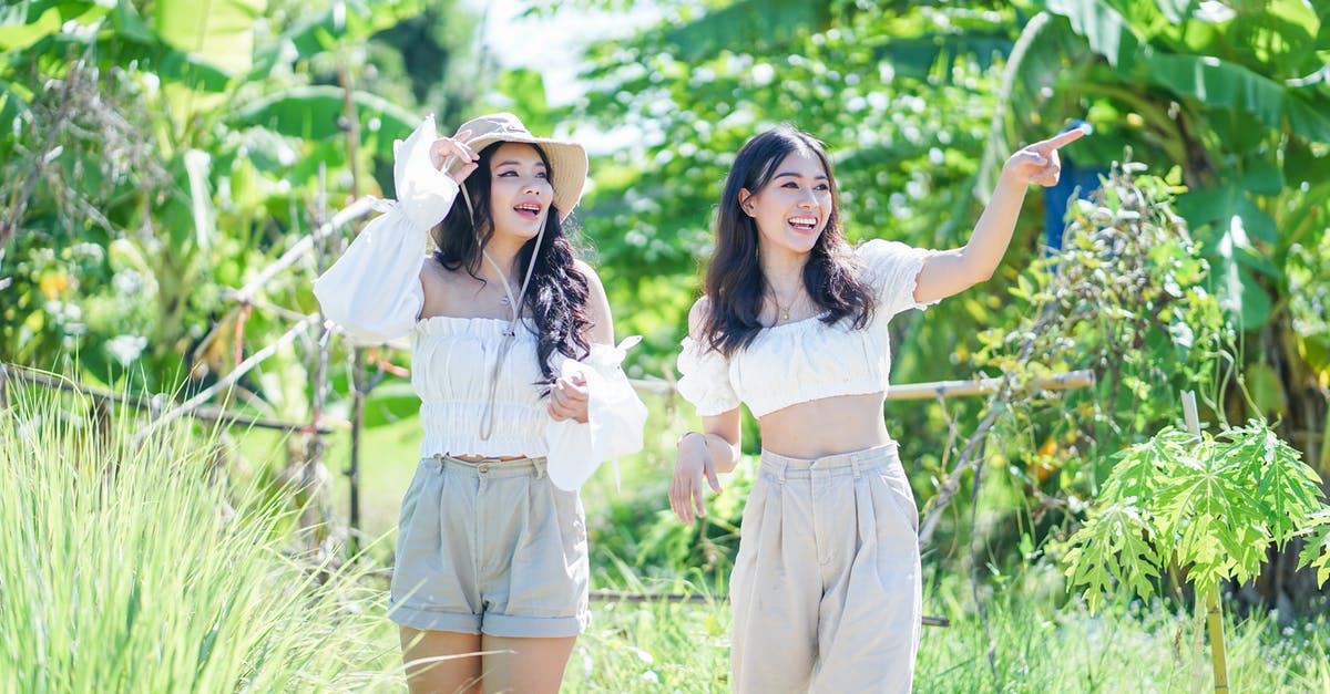 Short stay visa to Romania - Women Standing on Green Grass Field Short stay visa to Romania - Women Standing on Green Grass Field