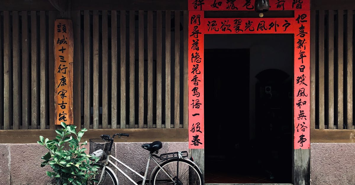 Shorter term Chinese visa - Black City Bike Parked Beside Red Wooden Door Shorter term Chinese visa - Black City Bike Parked Beside Red Wooden Door