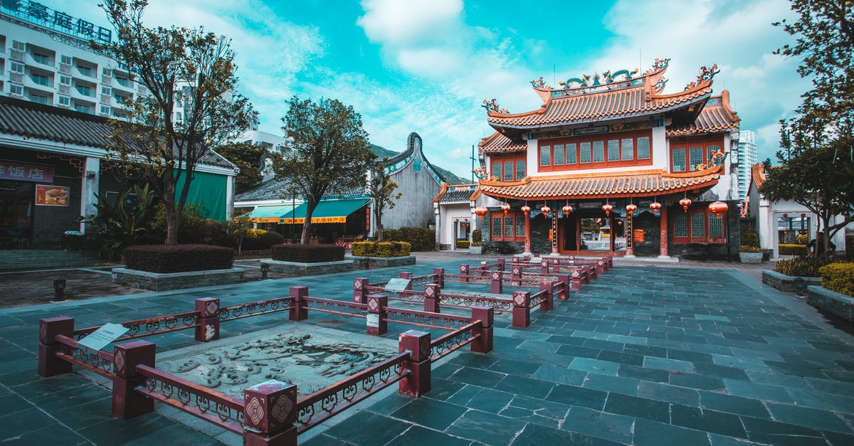 Shorter term Chinese visa - Red and White Concrete Building Under Blue Sky Shorter term Chinese visa - Red and White Concrete Building Under Blue Sky