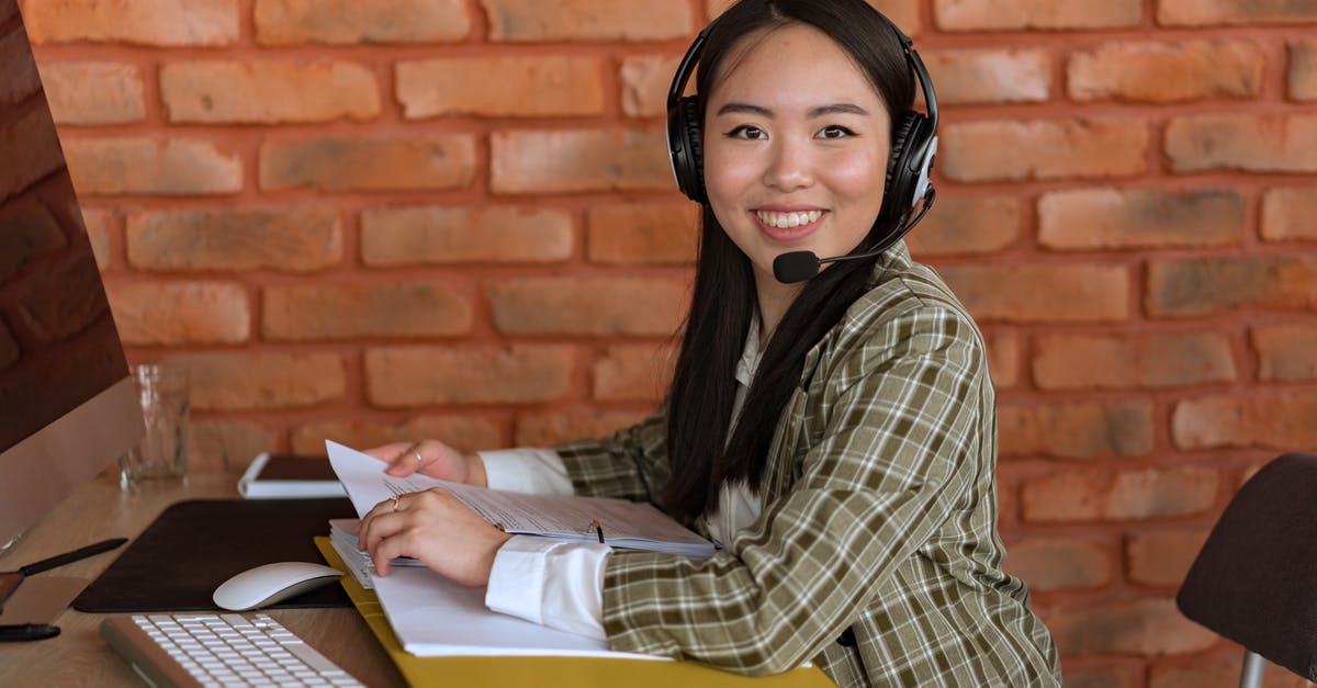 Shoul supporting documents for a Schengen visa be translated? - Woman in Plaid Blazer with Headset Looking at Camera Shoul supporting documents for a Schengen visa be translated? - Woman in Plaid Blazer with Headset Looking at Camera