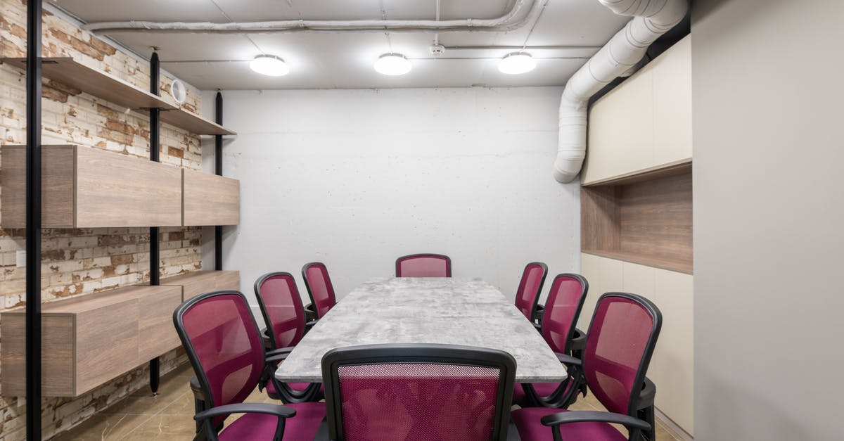 Should I apply for a UK visa to attend an onsite business meeting at a new job? - Table and chairs placed in modern conference hall in workspace illuminated by ceiling lamps Should I apply for a UK visa to attend an onsite business meeting at a new job? - Table and chairs placed in modern conference hall in workspace illuminated by ceiling lamps