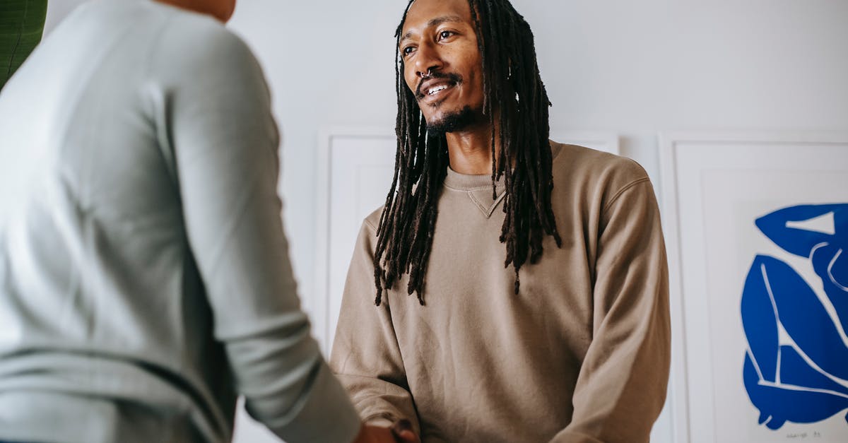 Should I be attending the visa appointment under below mentioned specific conditions? - Black man greeting crop psychologist in office Should I be attending the visa appointment under below mentioned specific conditions? - Black man greeting crop psychologist in office