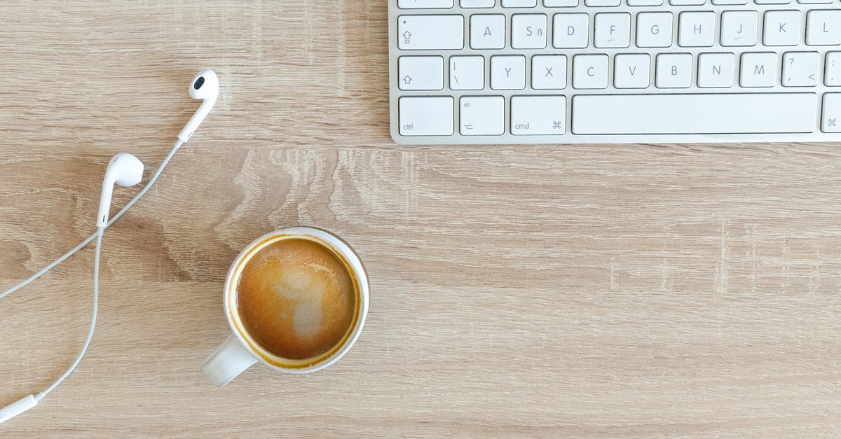 Should I declare a faux wood object to customs when entering Australia? - Beverage Filled Mug Near Apple Airpods With Lightning Connector and Apple Magic Keyboard