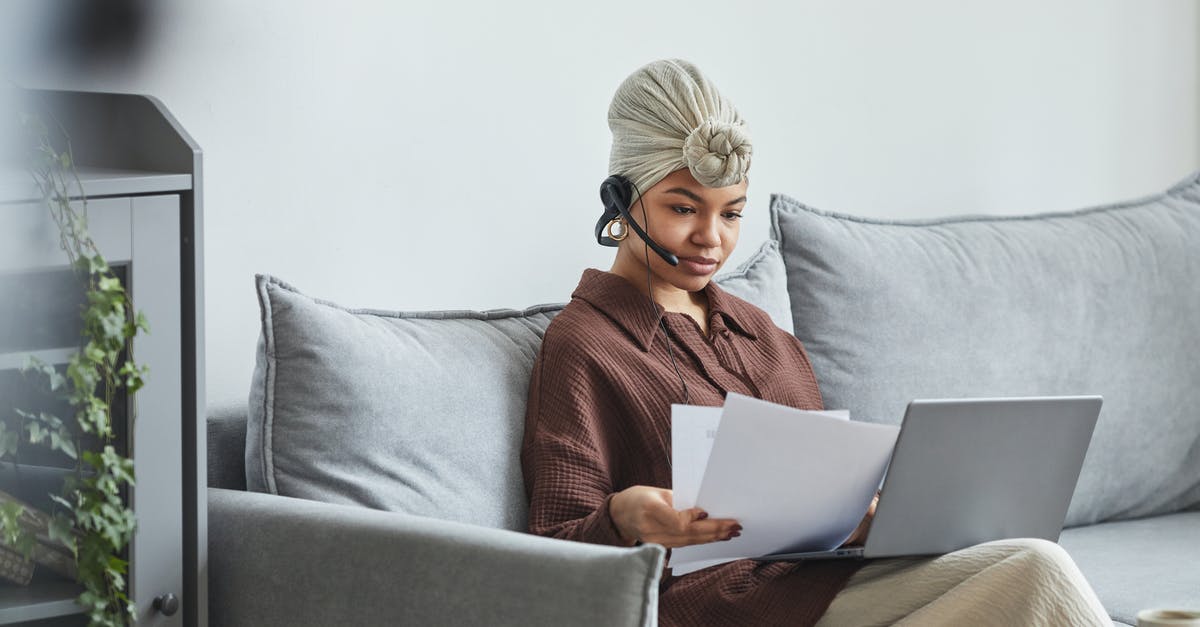 Should I Fabricate Additional Support Document after UK V 4.2 (a) +(c) refusal - Focused black woman with laptop examining documents