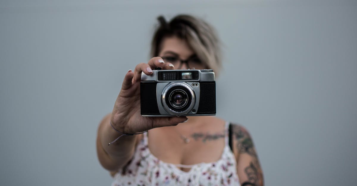 Should I just cover my forearm tattoo in Japan - Person Holding Camera Should I just cover my forearm tattoo in Japan - Person Holding Camera
