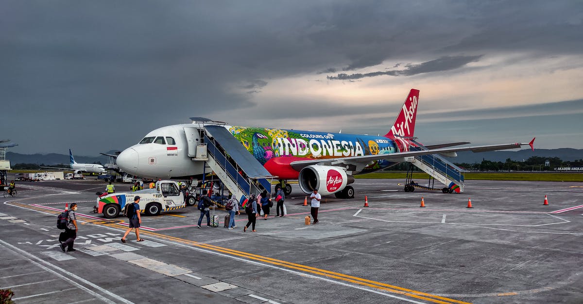 Should I pre-book/prepay for activities before landing in Bali? - White and Red Passenger Plane on Airport Should I pre-book/prepay for activities before landing in Bali? - White and Red Passenger Plane on Airport