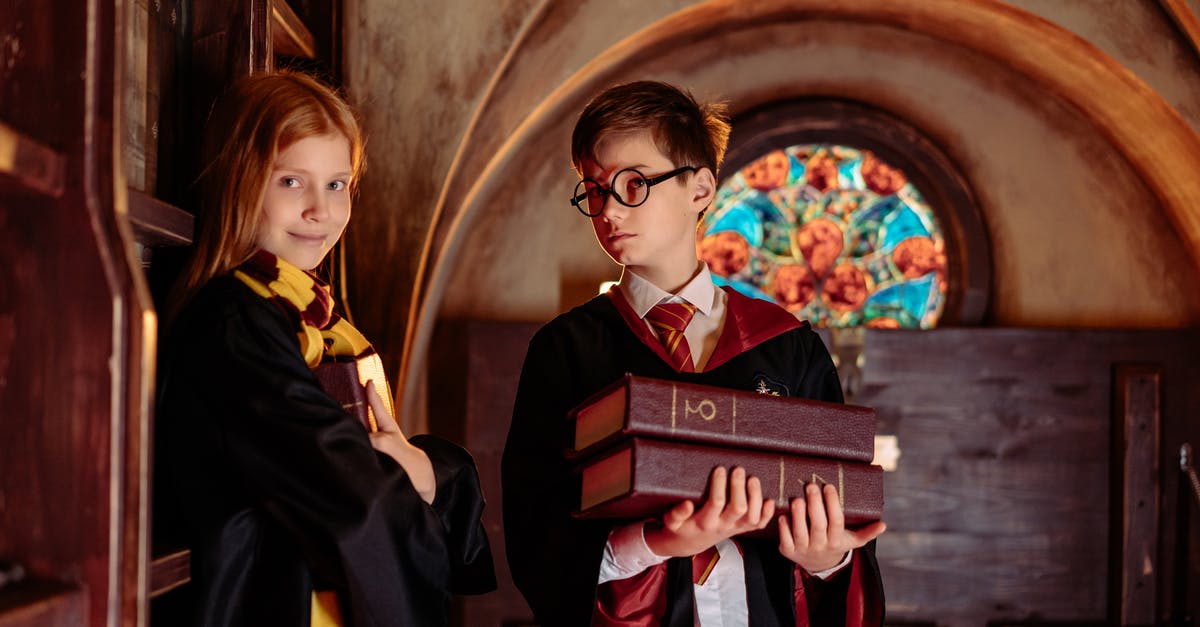 Should I put books in carry-on or checked luggage? - A Boy Holding Books with a Girl Should I put books in carry-on or checked luggage? - A Boy Holding Books with a Girl