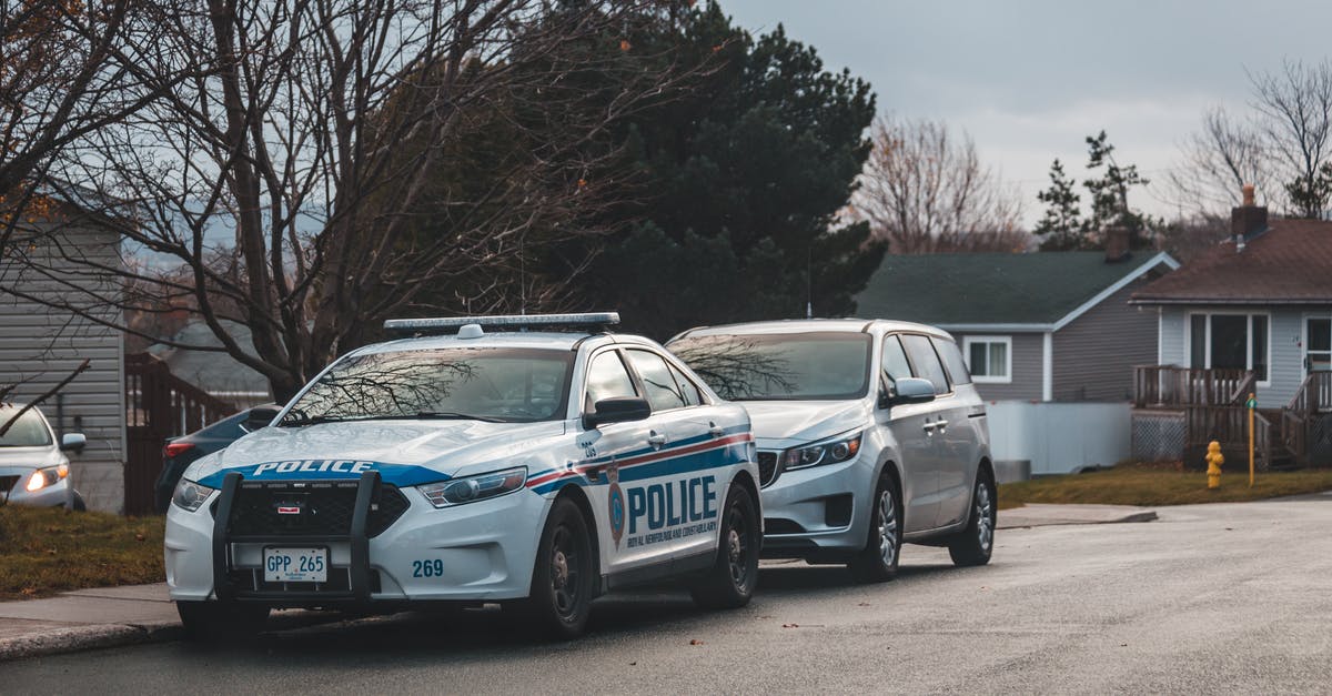 Should I report this UK road accident to the police? [closed] - Blue and White Police Car on Road