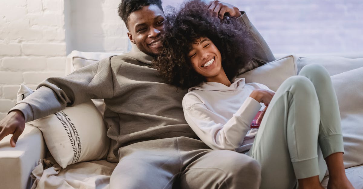 Should my non-American girlfriend mention her American boyfriend when applying for a visa? - Beloved African American couple cuddling and smiling on couch Should my non-American girlfriend mention her American boyfriend when applying for a visa? - Beloved African American couple cuddling and smiling on couch
