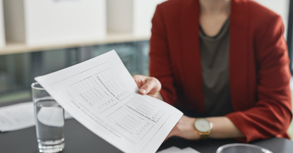 Should the required Covid19 documentation be printed on paper when travelling to France? - A Woman in Red Blazer Holding a Paper Should the required Covid19 documentation be printed on paper when travelling to France? - A Woman in Red Blazer Holding a Paper
