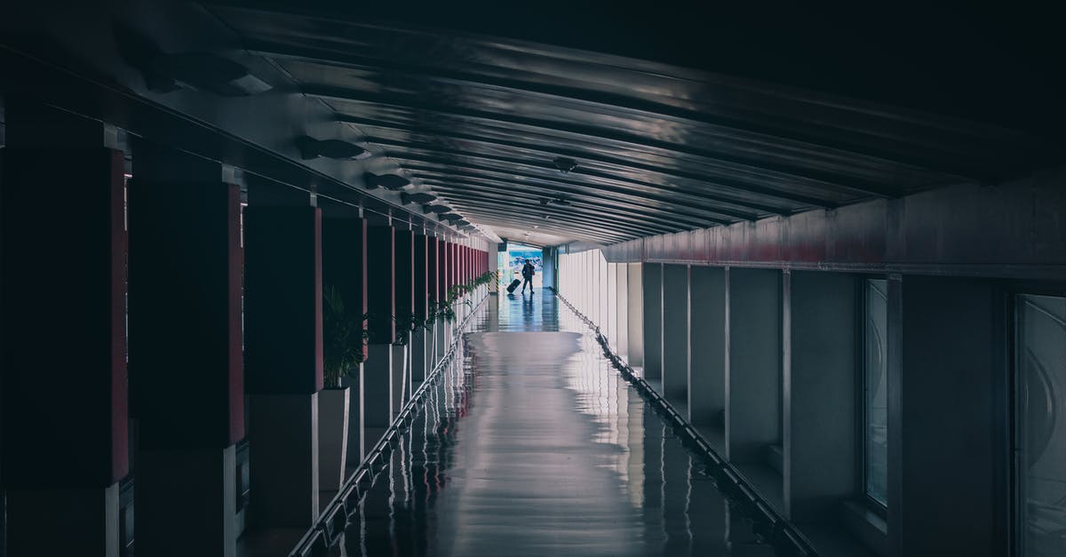 Shower rooms at Incheon airport - A Person Walking at the Corridor Shower rooms at Incheon airport - A Person Walking at the Corridor