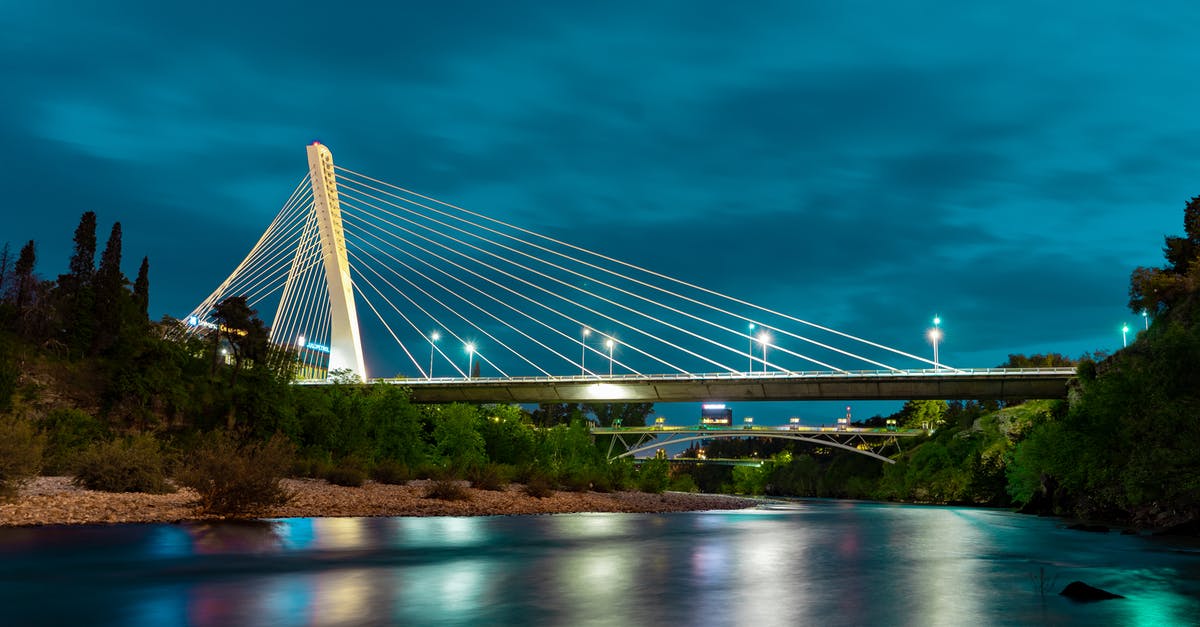 Shuttle bus from Podgorica town to the airport? - Bridge over calm reflected river surface Shuttle bus from Podgorica town to the airport? - Bridge over calm reflected river surface