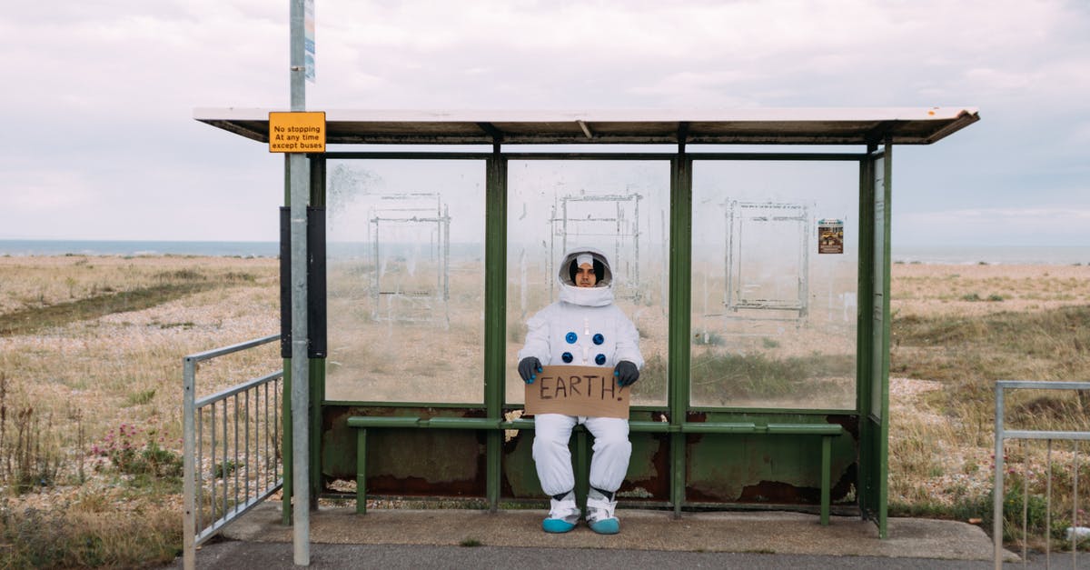 Signs for hitchhiking in Israel - Astronaut Waiting At A Bus Stop Signs for hitchhiking in Israel - Astronaut Waiting At A Bus Stop