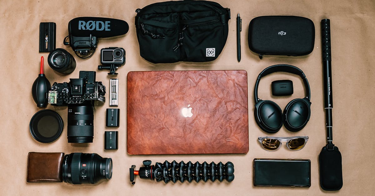 SIM requirements to phone abroad from the US? - Overhead view of laptop and photo camera composed with headphones and other gadgets of professional photographer SIM requirements to phone abroad from the US? - Overhead view of laptop and photo camera composed with headphones and other gadgets of professional photographer