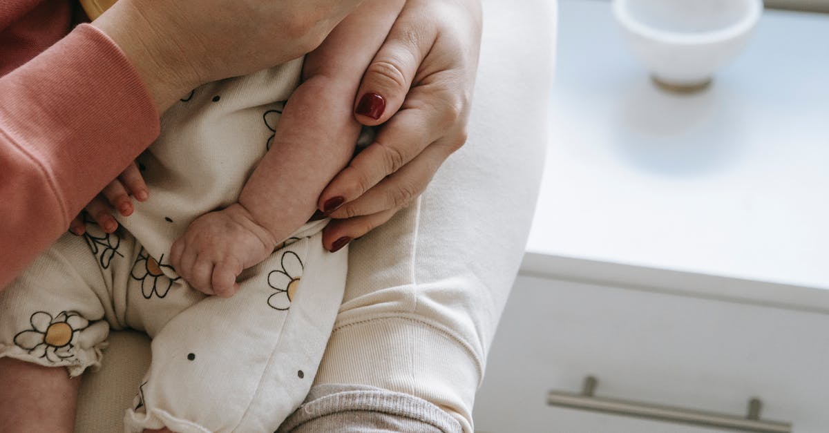 Singapore - Do we need to carry our Passport all the time? Or is the EP card enough? [closed] - Crop mother with baby in hands