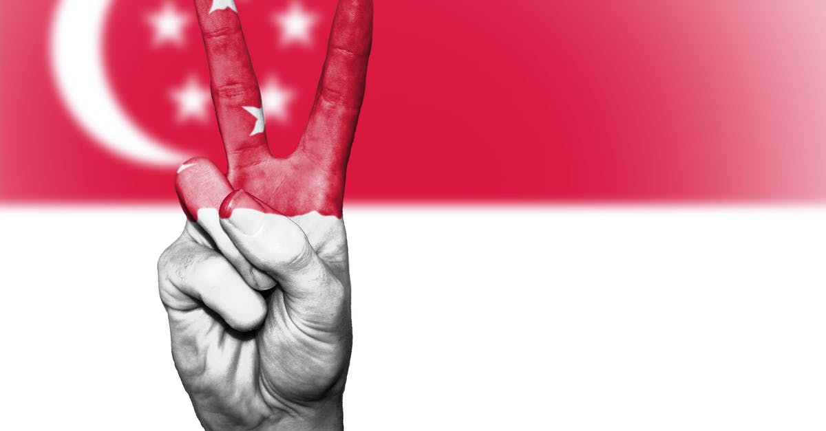 Singapore Airline-Transit for Level II Countries - Singapore flag-themed Painted Hand in Peace-sign Gesture Singapore Airline-Transit for Level II Countries - Singapore flag-themed Painted Hand in Peace-sign Gesture