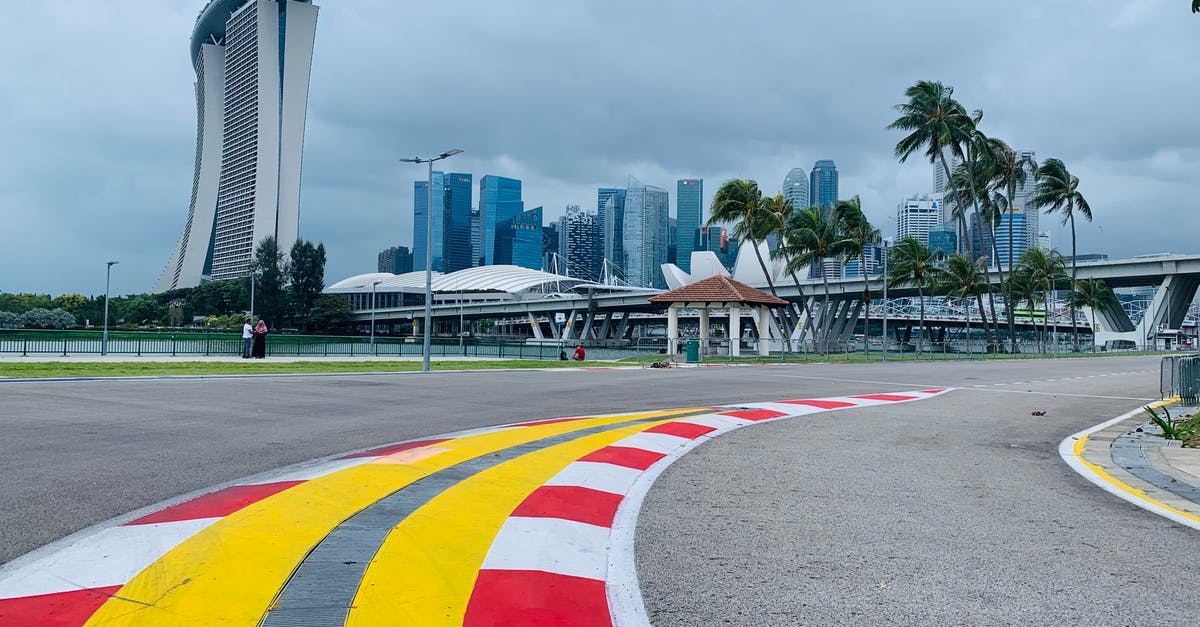 Singapore to Sydney to Canberra: where do we clear customs - Asphalt road on racetrack in modern city district Singapore to Sydney to Canberra: where do we clear customs - Asphalt road on racetrack in modern city district