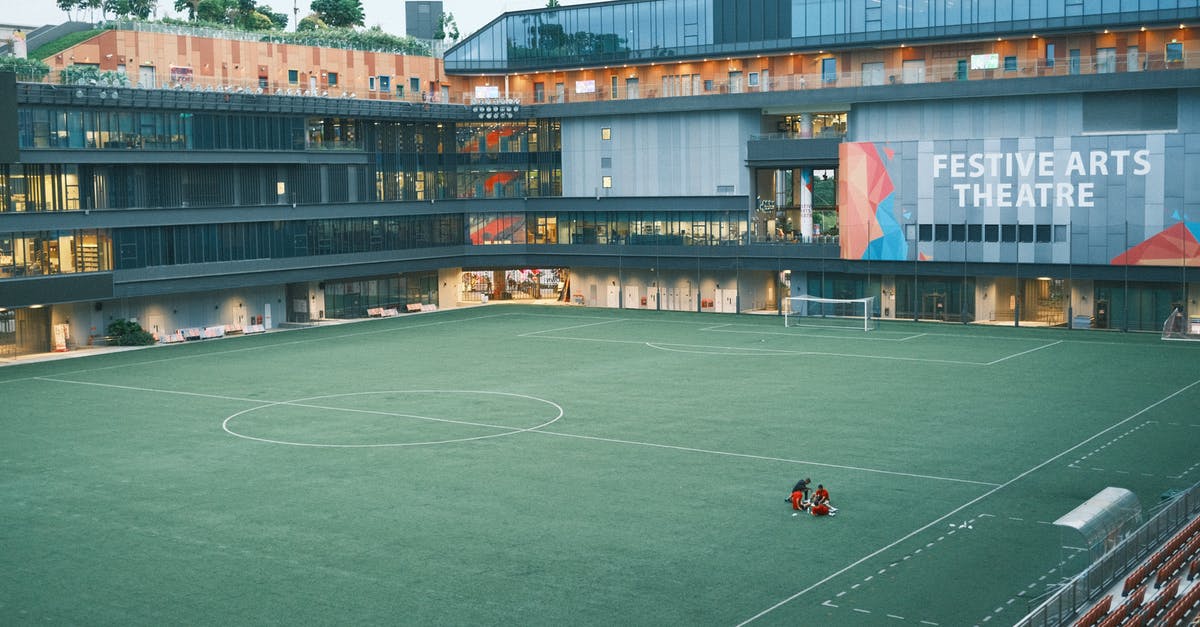 Singapore transit visa - People Playing Soccer on Green Field Singapore transit visa - People Playing Soccer on Green Field