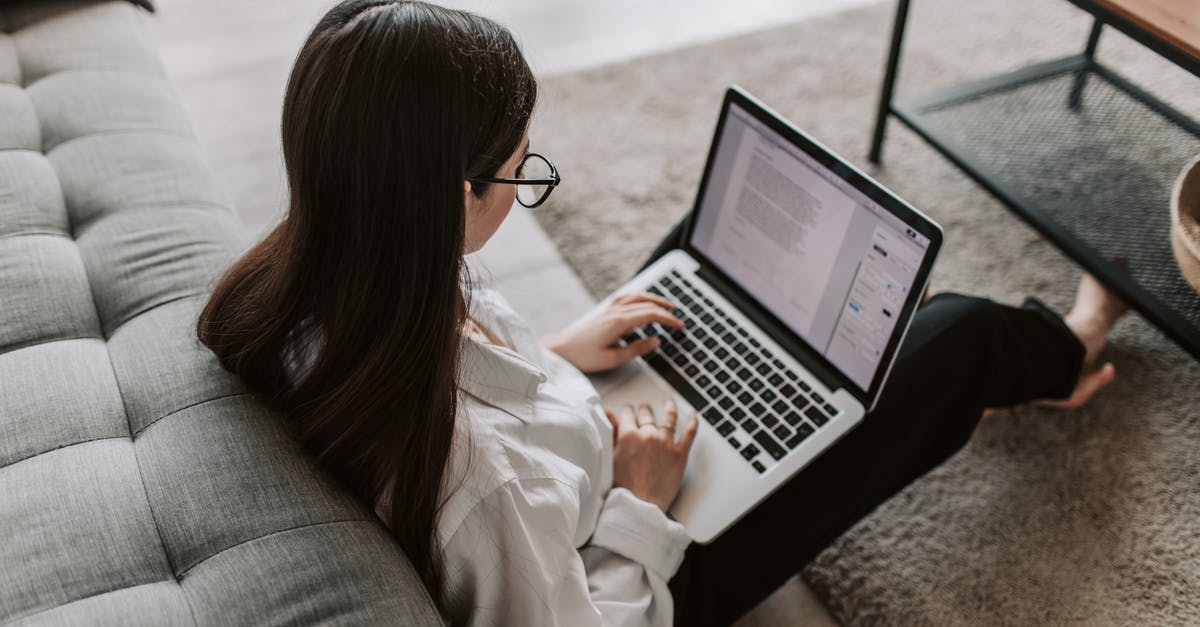 Singapore Visa for a freelance Software Engineer - Woman Working At Home Using Her Laptop Singapore Visa for a freelance Software Engineer - Woman Working At Home Using Her Laptop