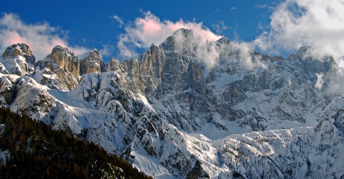 Skiing in the French Alps - by Van - Snow Covered Mountains Under Blue Sky Skiing in the French Alps - by Van - Snow Covered Mountains Under Blue Sky