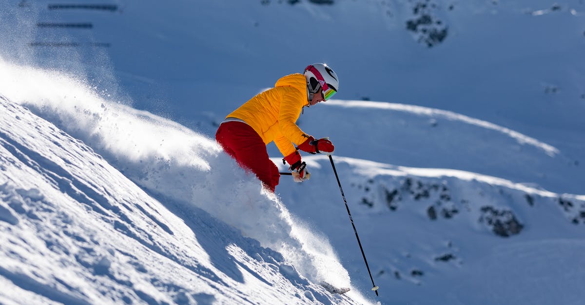 Skiing near Frankfurt 18-23 February - Person in Red Jacket and Blue Pants Riding on Ski Blades on Snow Covered Mountain during Skiing near Frankfurt 18-23 February - Person in Red Jacket and Blue Pants Riding on Ski Blades on Snow Covered Mountain during