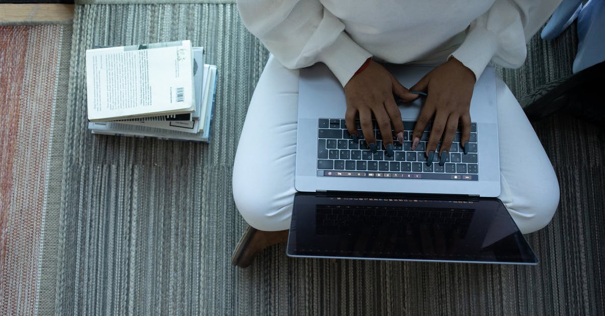 Skip leg and book a connection with the same airline [duplicate] - Top view of anonymous African American female student sitting with crossed legs and typing on netbook sitting near stack of books