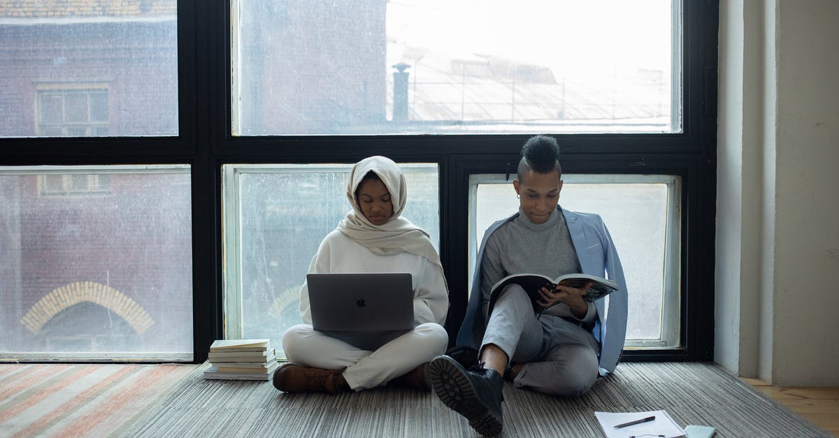 Skip leg and book a connection with the same airline [duplicate] - Serious black classmates doing homework together near panoramic window