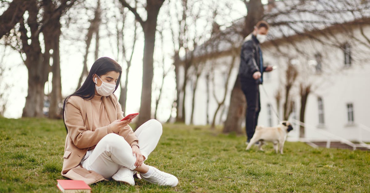 Skip leg and book a connection with the same airline [duplicate] - Serious woman using smartphone on lawn in square