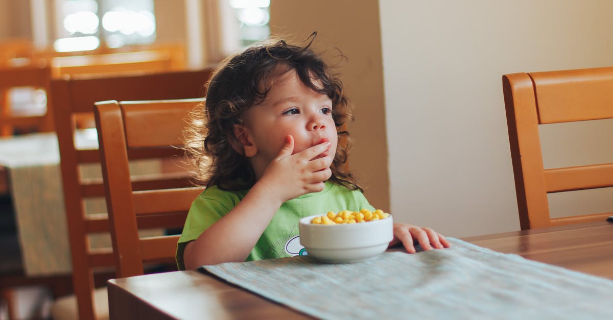 Small children to see the Queen's Horse Guards in London? - Child Sitting at Table Eating Breakfast Small children to see the Queen's Horse Guards in London? - Child Sitting at Table Eating Breakfast