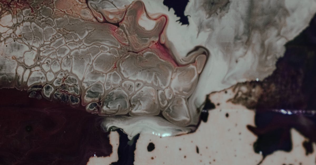 Small oil stains on the bio-data page of my UK passport. Is this "damaged"? - Overhead view of abstract background representing ink flows and blended paints with small spots Small oil stains on the bio-data page of my UK passport. Is this "damaged"? - Overhead view of abstract background representing ink flows and blended paints with small spots