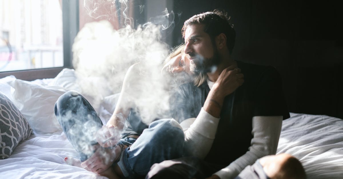 Smoking weed in Amsterdam as a tourist - Man in Black Long Sleeve Shirt Smoking Cigarette Smoking weed in Amsterdam as a tourist - Man in Black Long Sleeve Shirt Smoking Cigarette