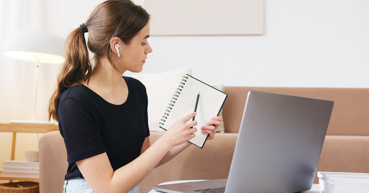 South Korean Visa for Research Conference - Focused woman using laptop while attending online webinar South Korean Visa for Research Conference - Focused woman using laptop while attending online webinar