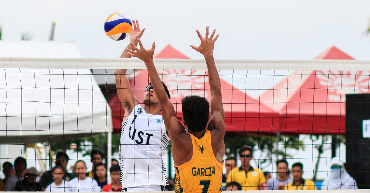 South-west US/Hawaii Volleyball fun tournament in September - Two Men Playing Volleyball Near Red Canopy South-west US/Hawaii Volleyball fun tournament in September - Two Men Playing Volleyball Near Red Canopy