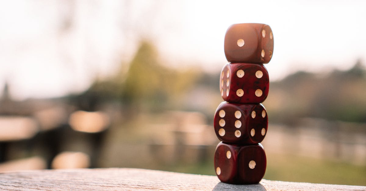 South-west US/Hawaii Volleyball fun tournament in September - Set of red dice stacked together on wooden table placed on sunny terrace in daylight South-west US/Hawaii Volleyball fun tournament in September - Set of red dice stacked together on wooden table placed on sunny terrace in daylight
